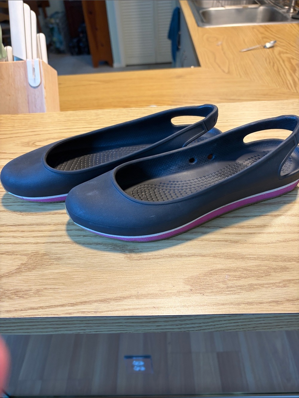 CROCS Black Slip-On Flats with Pink Trim